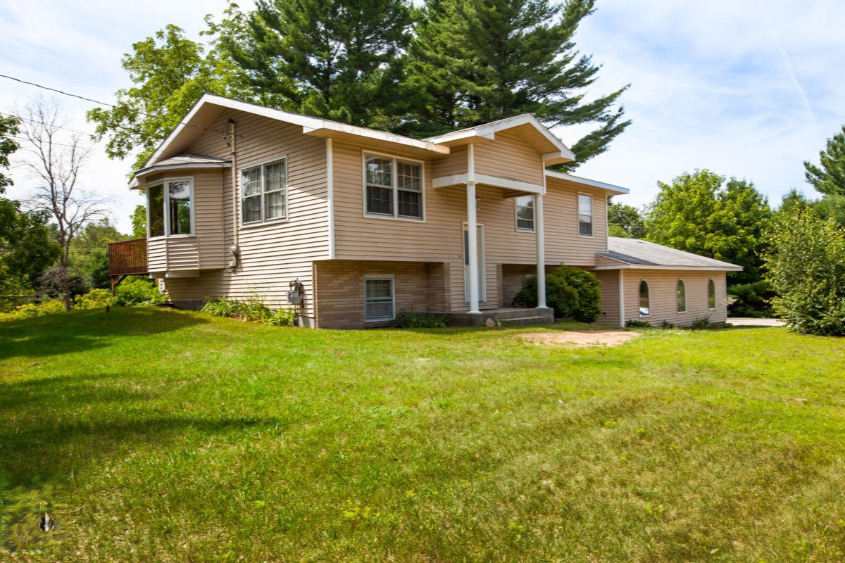 1191 West Tyler Road Muskegon, MI 49445 - Photo 1 of 23 Angled Front