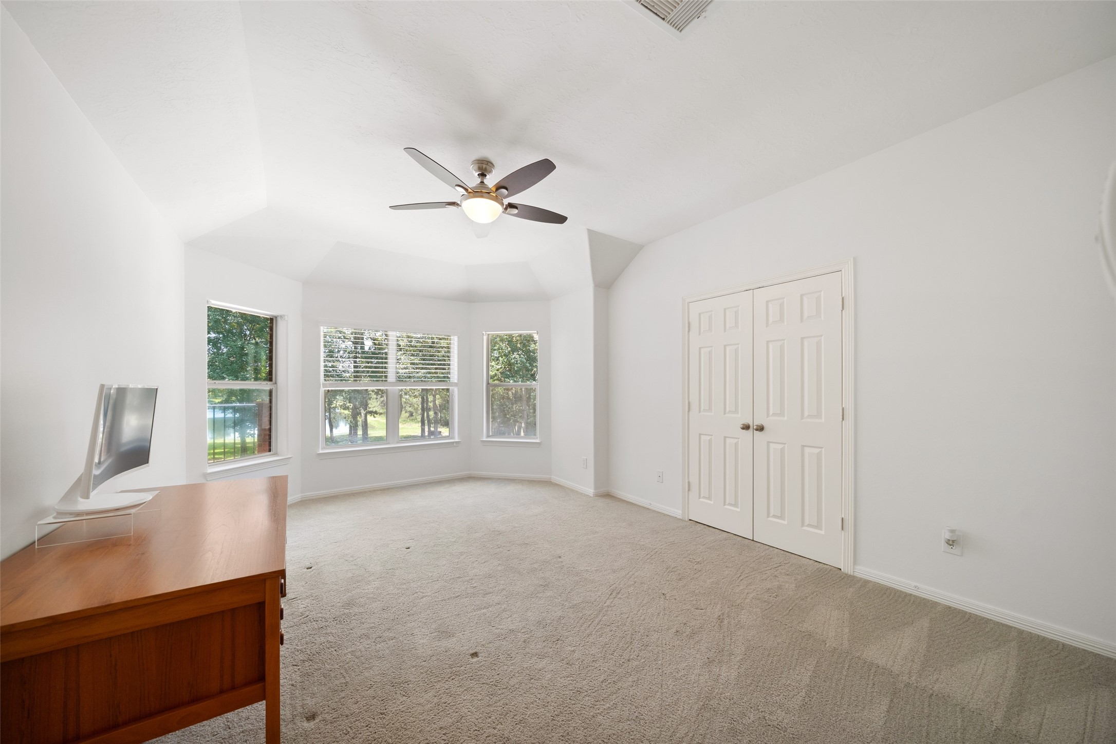 2302 Legends Shore Drive Spring, TX 77386 - Photo 36 of 48 Large bedroom with soaring ceilings and beautiful windows overlooking the backyard.