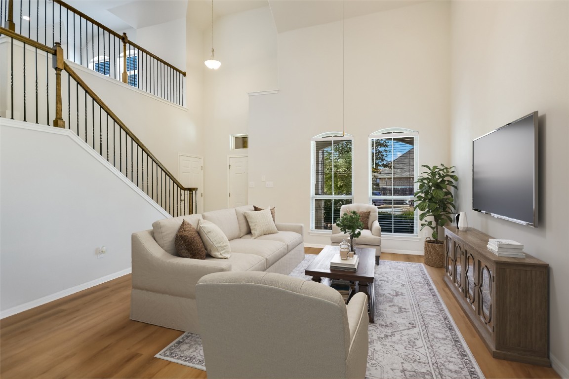a living room with fireplace furniture and a flat screen tv