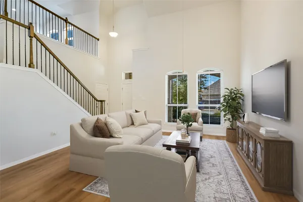 a living room with fireplace furniture and a flat screen tv