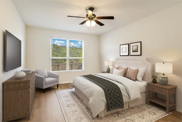 a bedroom with a bed and a couch