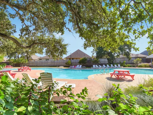a view of swimming pool with a patio