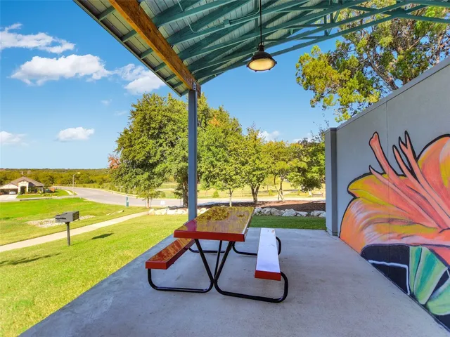 a view of a swimming pool and an outdoor space