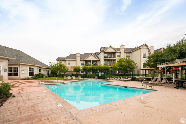 900 Bitner Road, Unit M 17 Park City, UT 84098 - Photo 26 of 29 Community pool with a patio area and a pergola