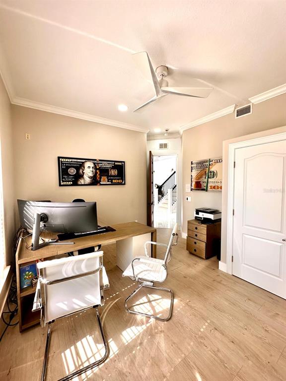 1407 Water Lilly Lane Kissimmee, FL 34744 - Photo 54 of 100 a living room with furniture a flat screen tv and white walls