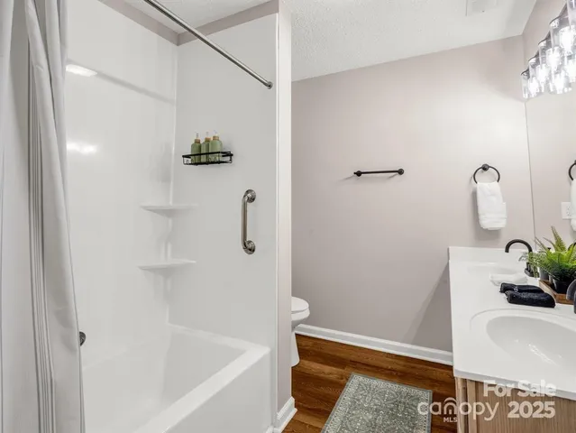 a bathroom with a tub and sink