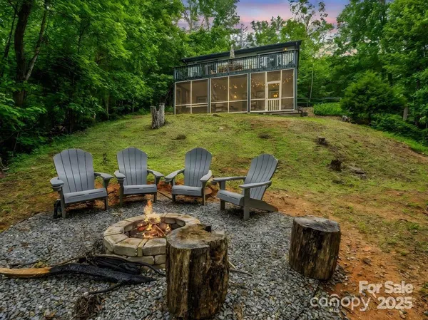 a view of a backyard with table and chairs with a yard