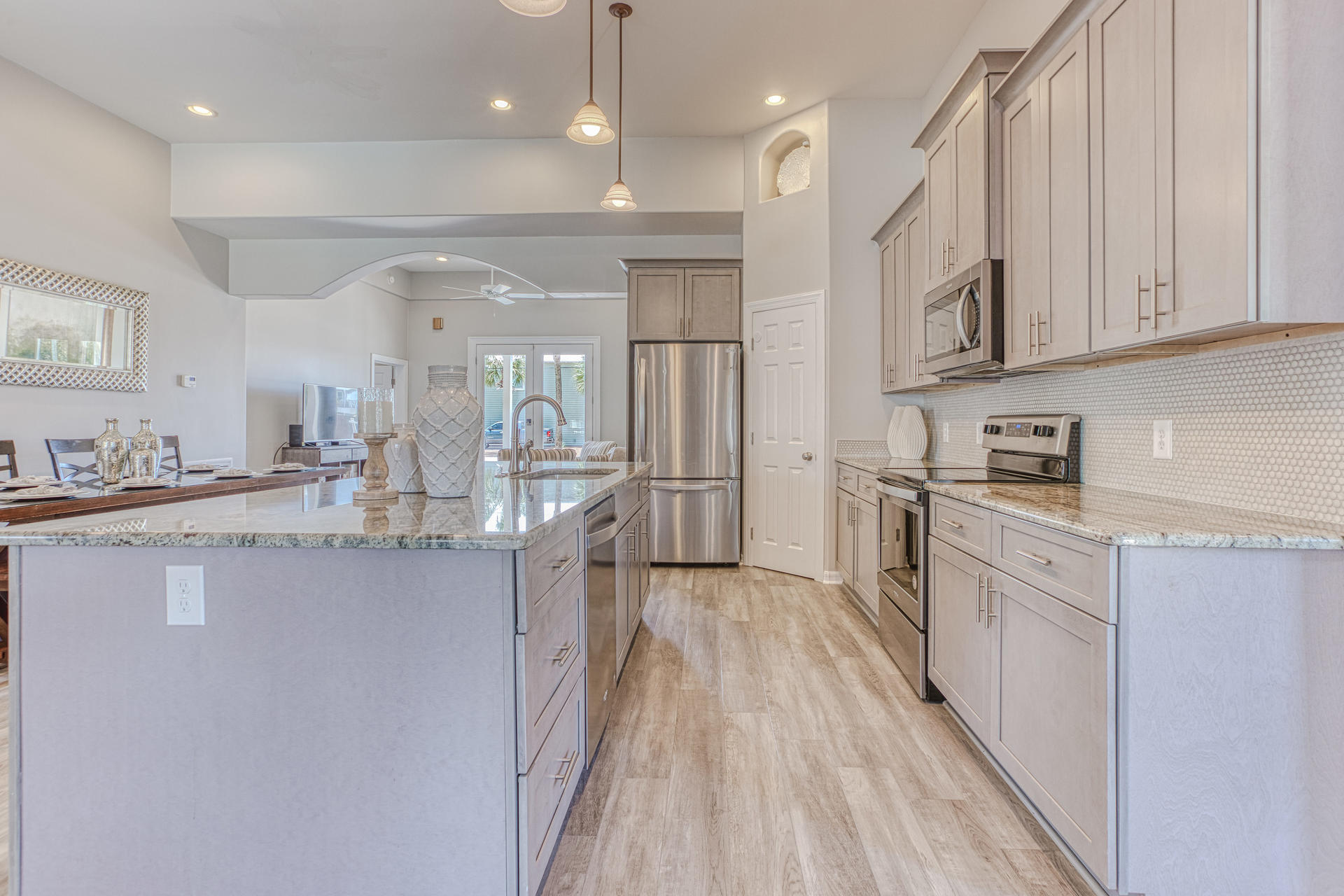 4583 Luke Avenue Destin, FL 32541 - Photo 13 of 86 a kitchen with stainless steel appliances granite countertop lots of counter top space and cabinets