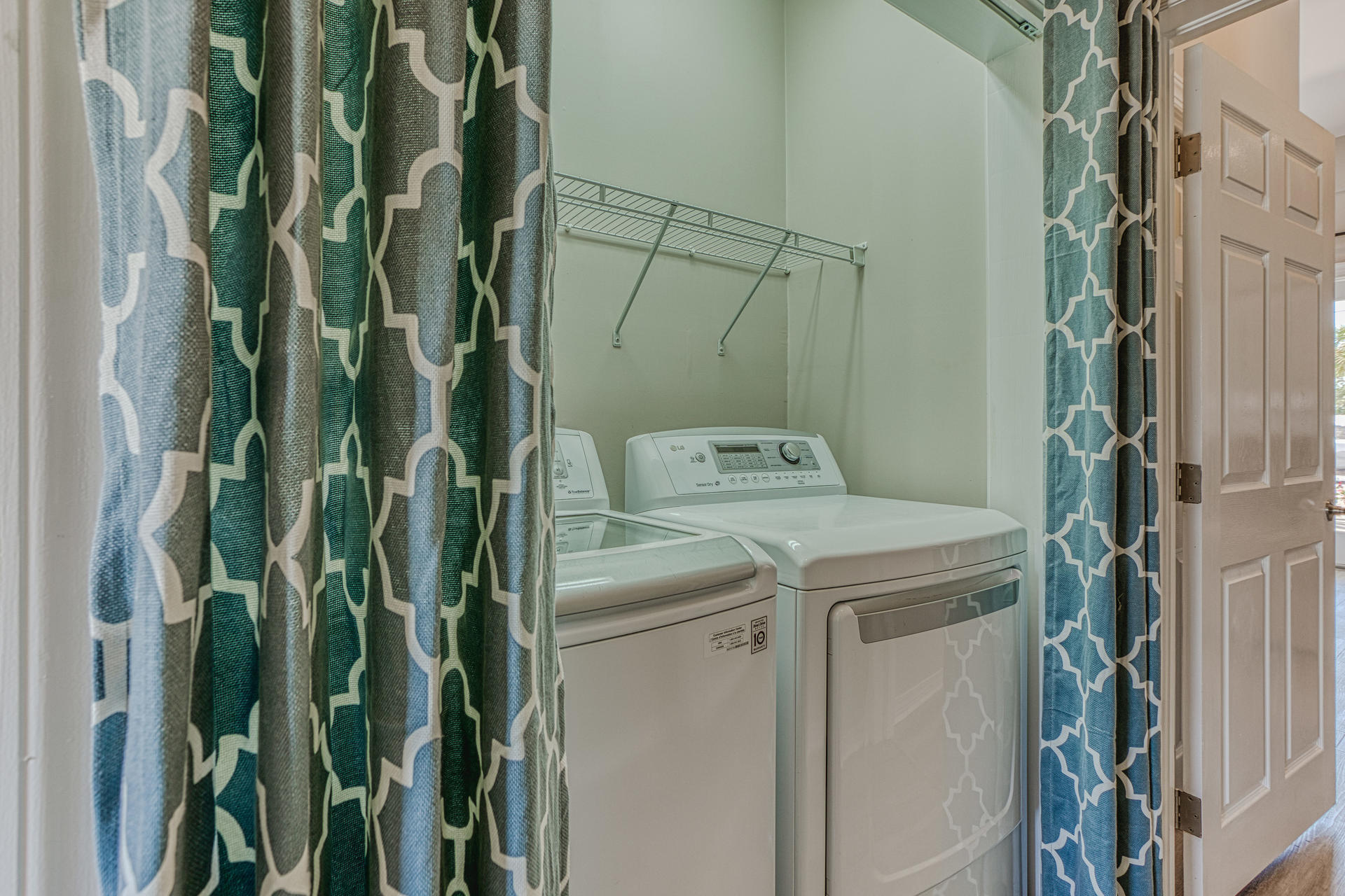 4583 Luke Avenue Destin, FL 32541 - Photo 19 of 86 a utility room with dryer and washer