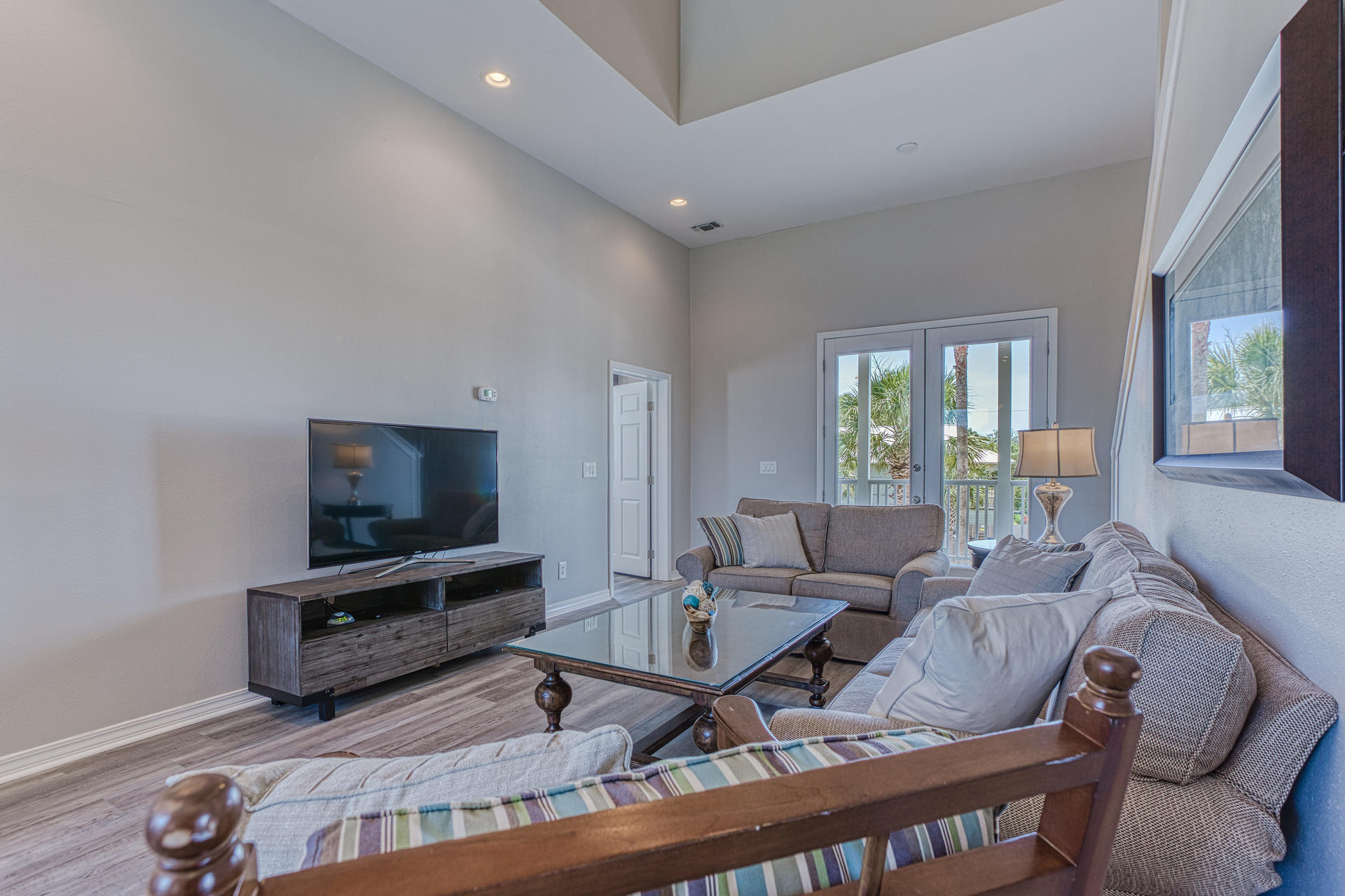 4583 Luke Avenue Destin, FL 32541 - Photo 33 of 86 a living room with furniture a flat screen tv and a large window