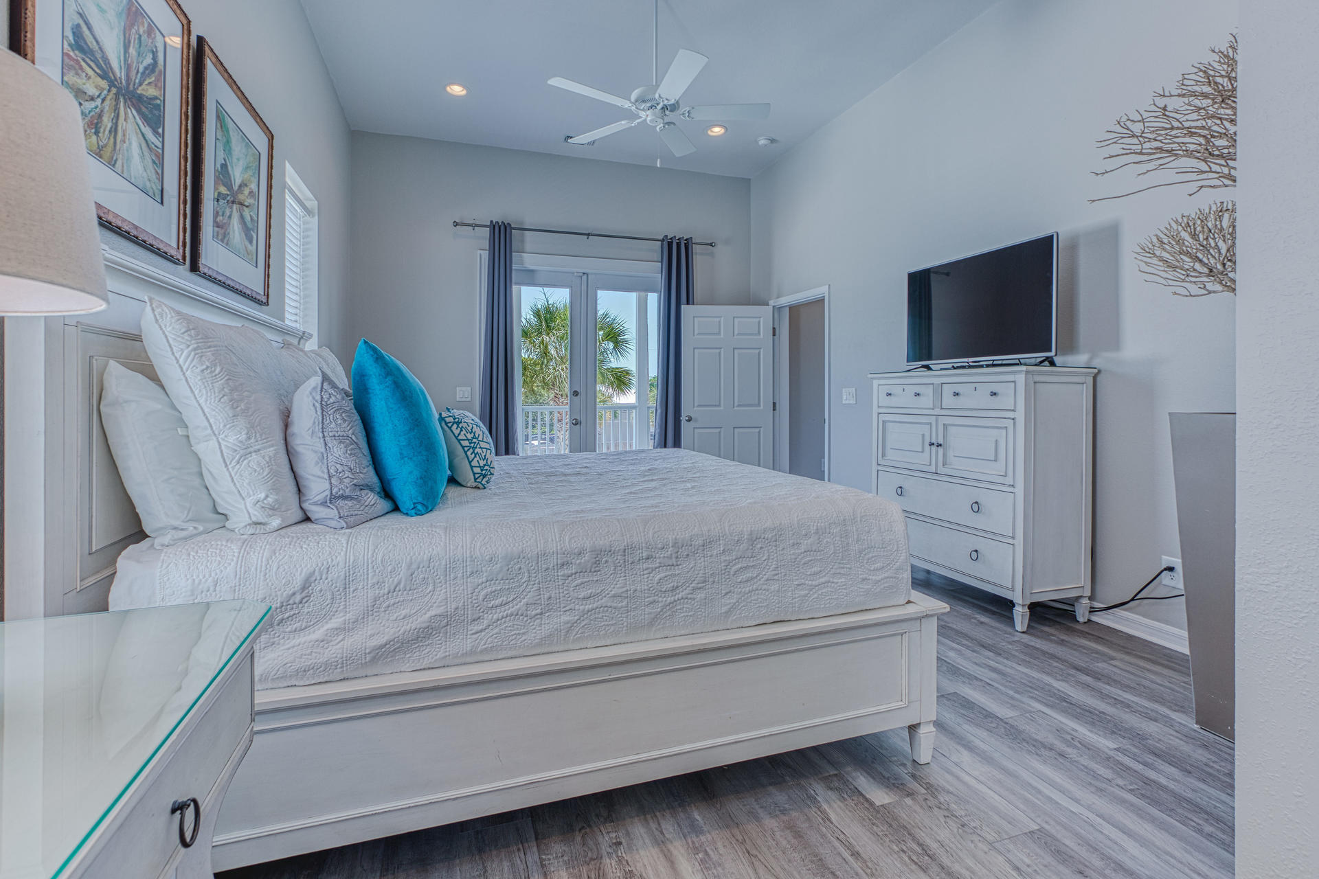 4583 Luke Avenue Destin, FL 32541 - Photo 43 of 86 a spacious bedroom with a bed and a flat screen tv