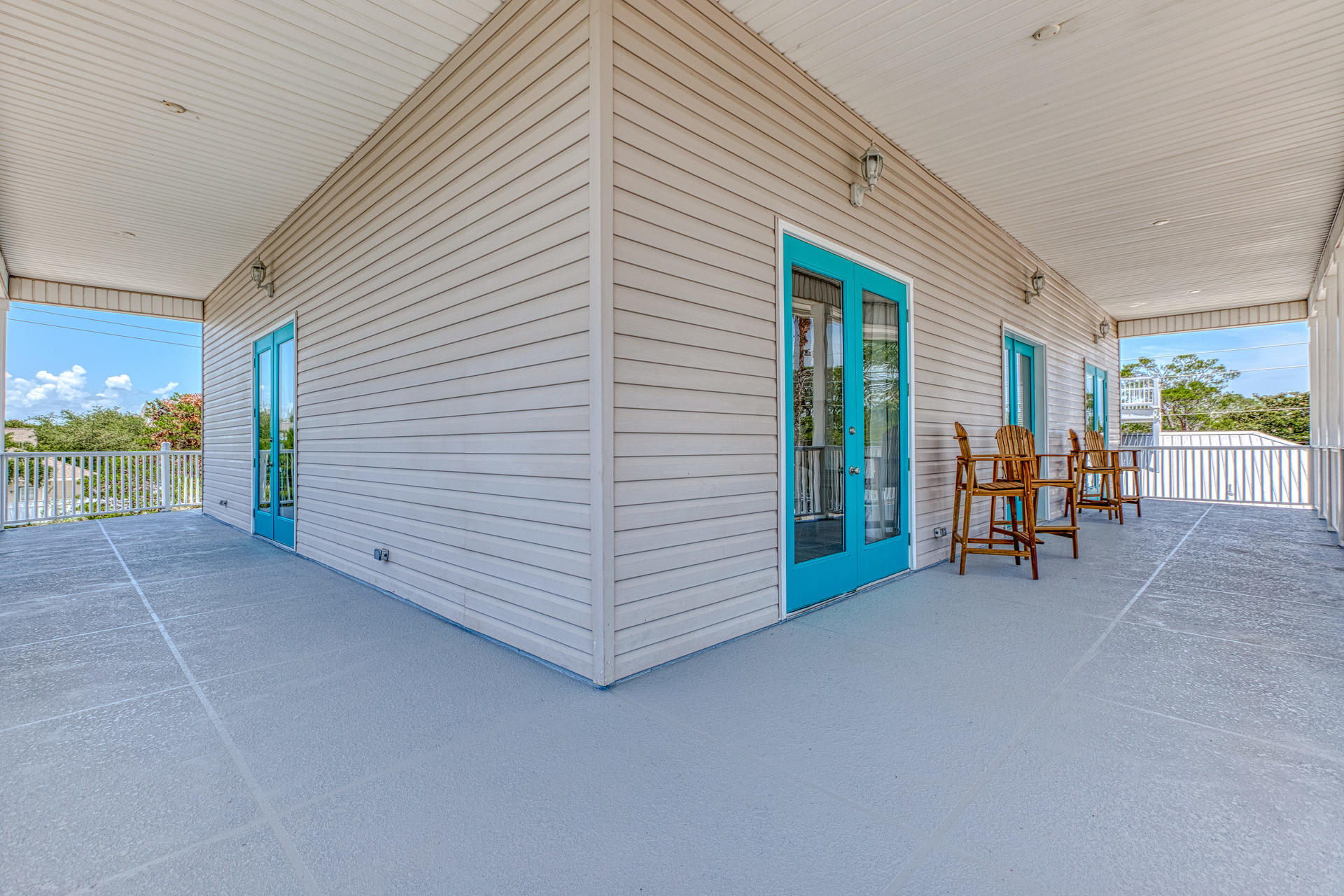 4583 Luke Avenue Destin, FL 32541 - Photo 50 of 86 a view of a patio with table and chairs and a barbeque