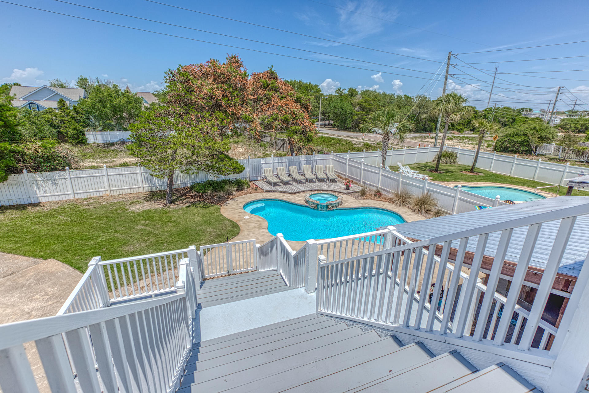 4583 Luke Avenue Destin, FL 32541 - Photo 53 of 86 a view of a chairs and deck in the patio with a yard