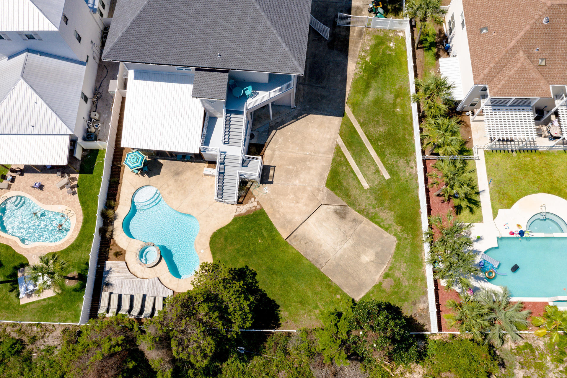 4583 Luke Avenue Destin, FL 32541 - Photo 84 of 86 an aerial view of a swimming pool with outdoor seating and yard