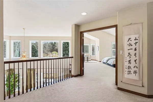 a view of a hallway with windows and couch