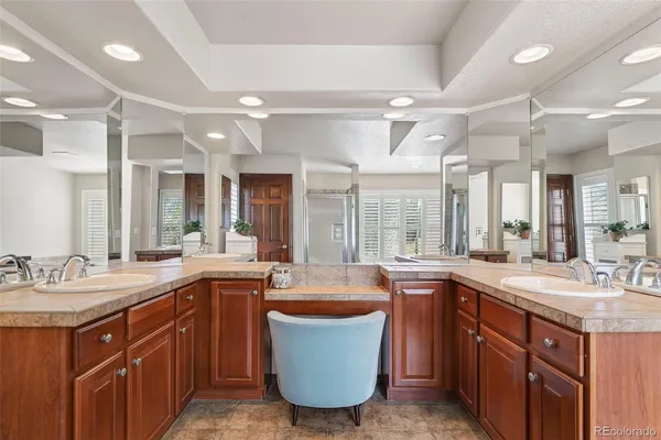 a large kitchen with a large window and sink