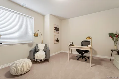 a bedroom with furniture and a window