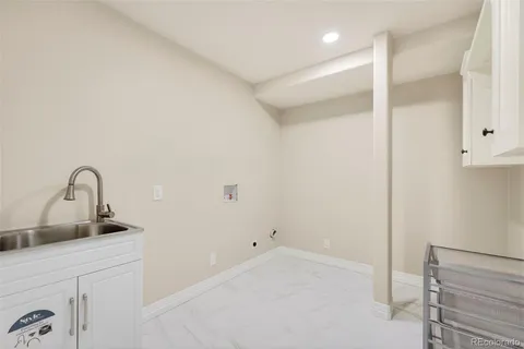 a kitchen with a sink and cabinets