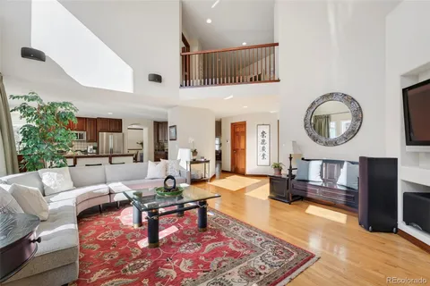 a living room with furniture and a clock