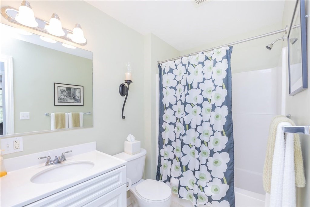 38 Village Road, Unit 312 Middleton, MA 01949 - Photo 28 of 42 a bathroom with a sink toilet and shower