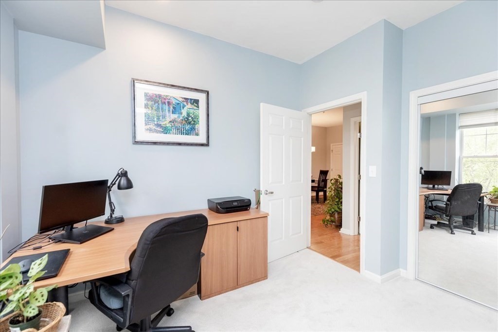 38 Village Road, Unit 312 Middleton, MA 01949 - Photo 31 of 42 a bedroom with a workspace