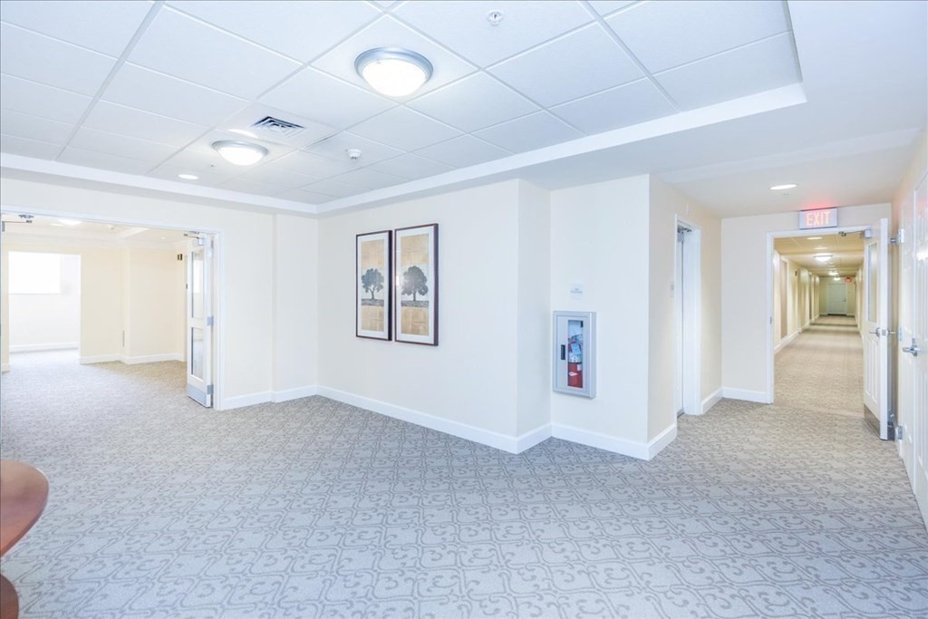 38 Village Road, Unit 312 Middleton, MA 01949 - Photo 5 of 42 a view of a livingroom with an empty space