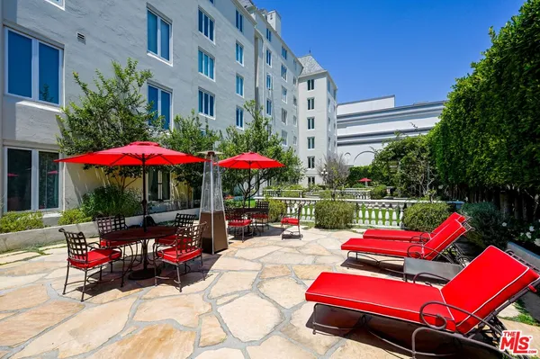 a living room with a chandelier furniture and a chandelier