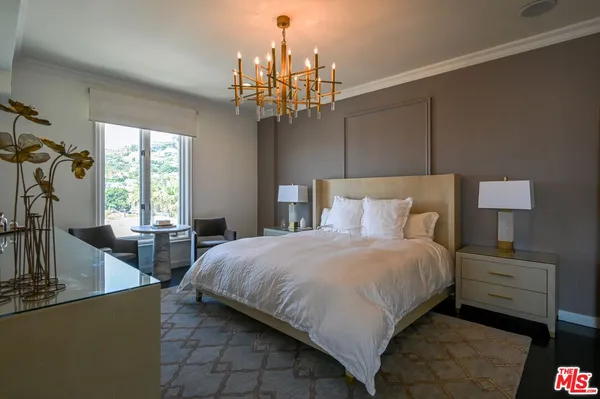 a bedroom with bed and window