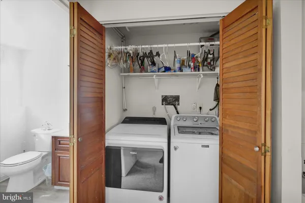 a utility room with dryer and washer
