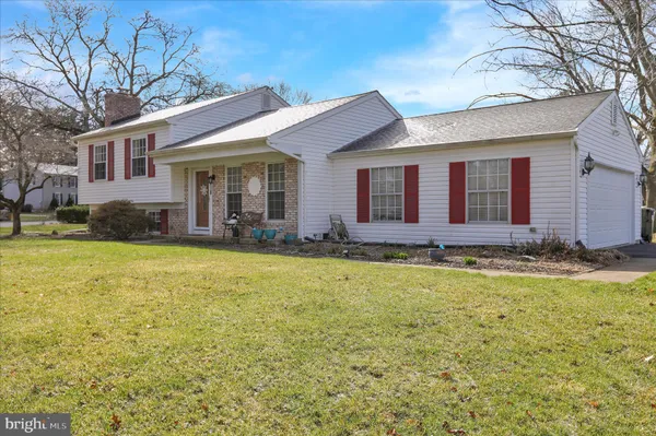 a view of a house with swimming pool and porch