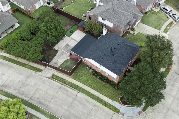 an aerial view of house with yard