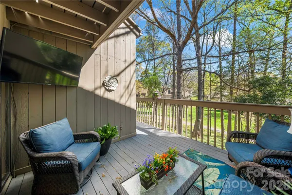 a view of balcony with furniture