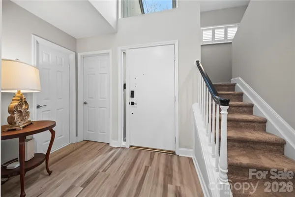 a view of a livingroom with furniture and wooden floor