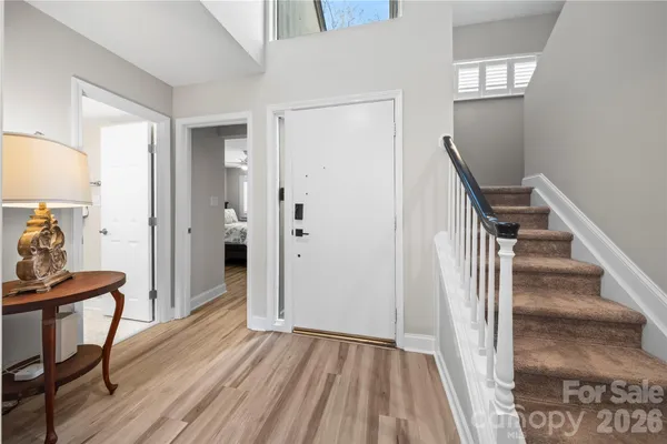 a view of a livingroom with furniture and wooden floor