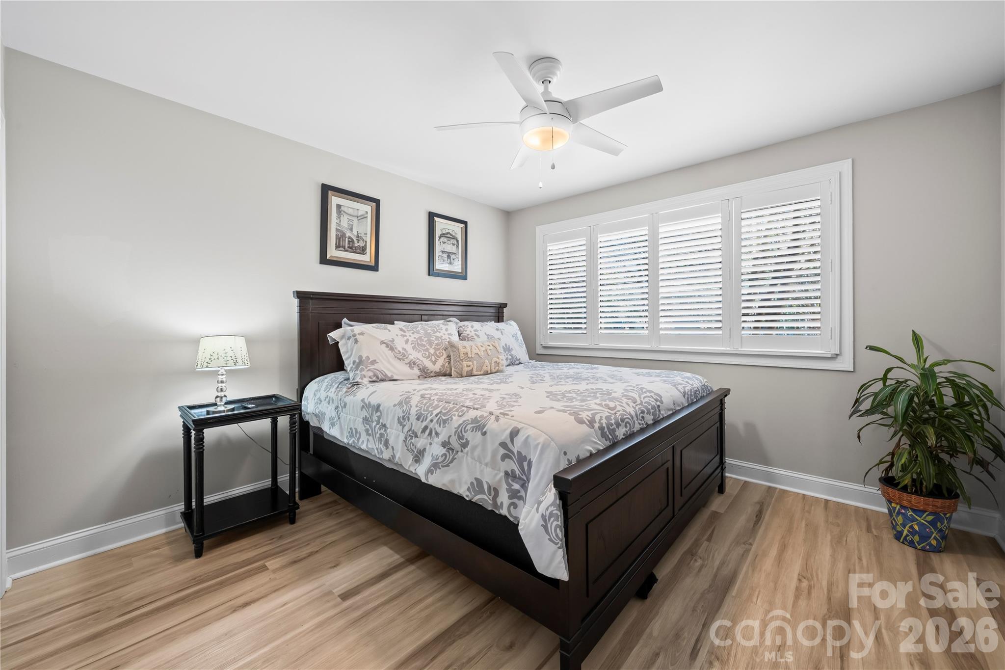 133 Pine Grove Circle Clover, SC 29710 - Photo 16 of 48 a bedroom with a bed and a potted plant