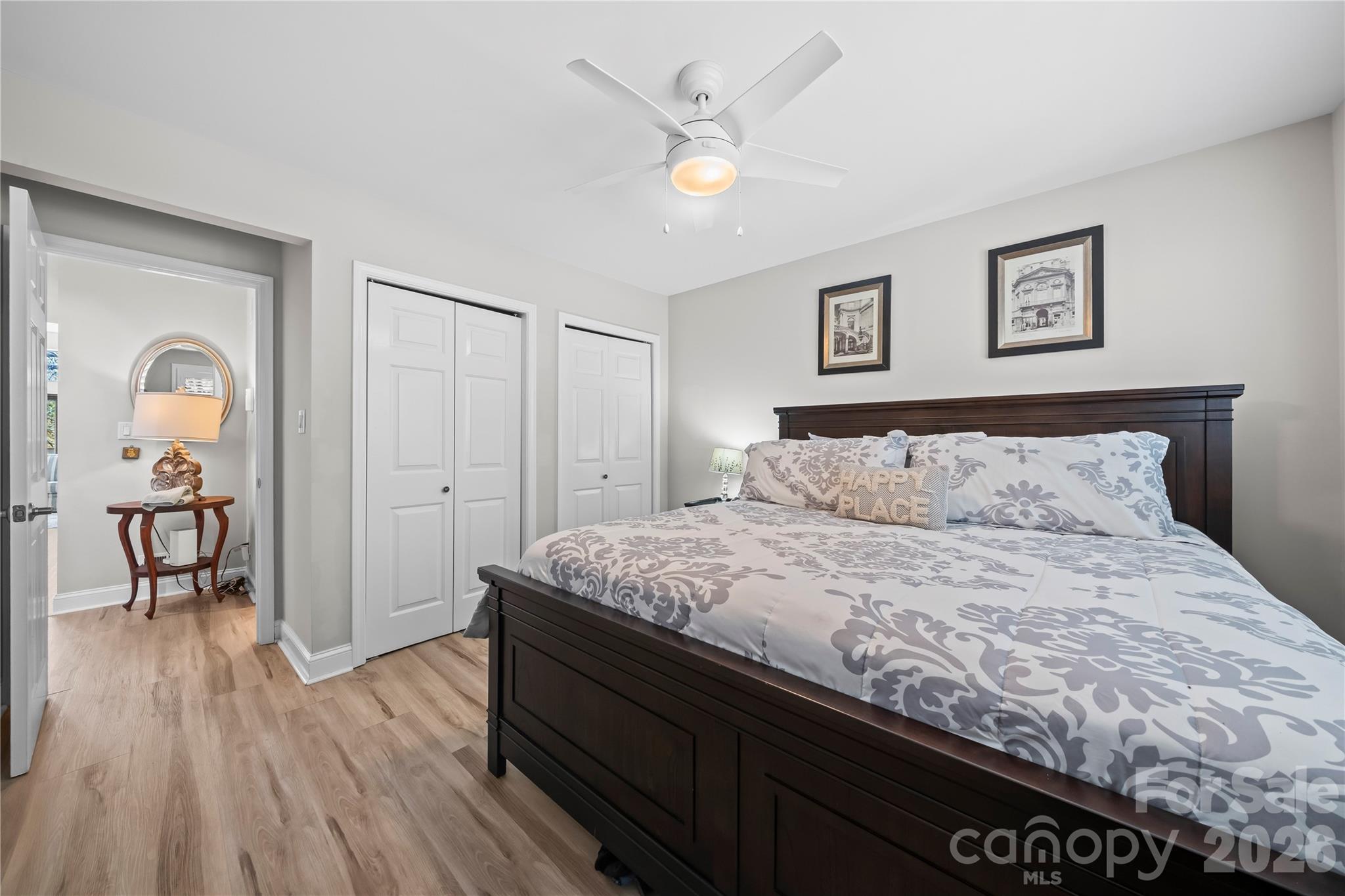 133 Pine Grove Circle Clover, SC 29710 - Photo 17 of 48 a bedroom with a bed and a chandelier