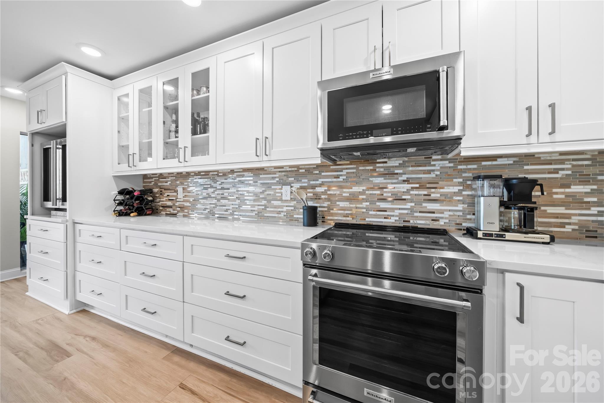 133 Pine Grove Circle Clover, SC 29710 - Photo 22 of 48 a kitchen with granite countertop white cabinets stainless steel appliances and sink
