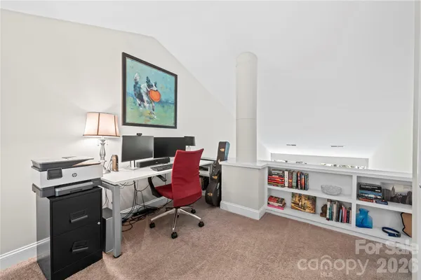 a view of a workspace with furniture