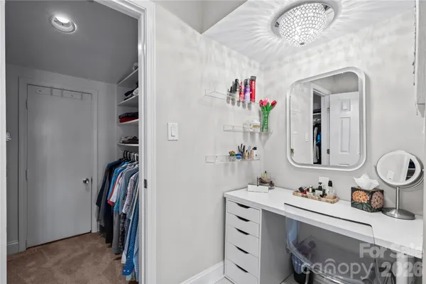 a bathroom with a sink double vanity and a mirror