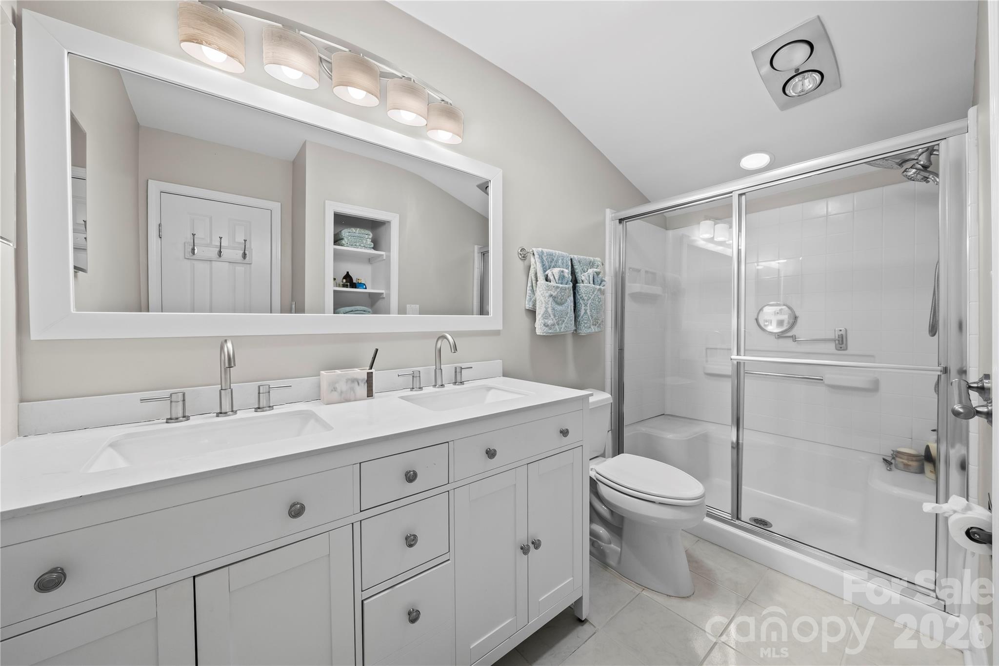133 Pine Grove Circle Clover, SC 29710 - Photo 35 of 48 a spacious bathroom with a granite countertop sink toilet mirror and shower