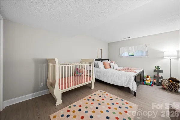 a bedroom with furniture and a window