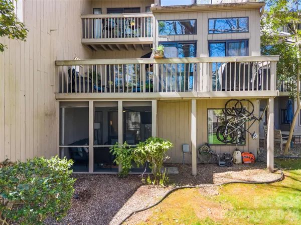 a view of front of house with a swimming pool