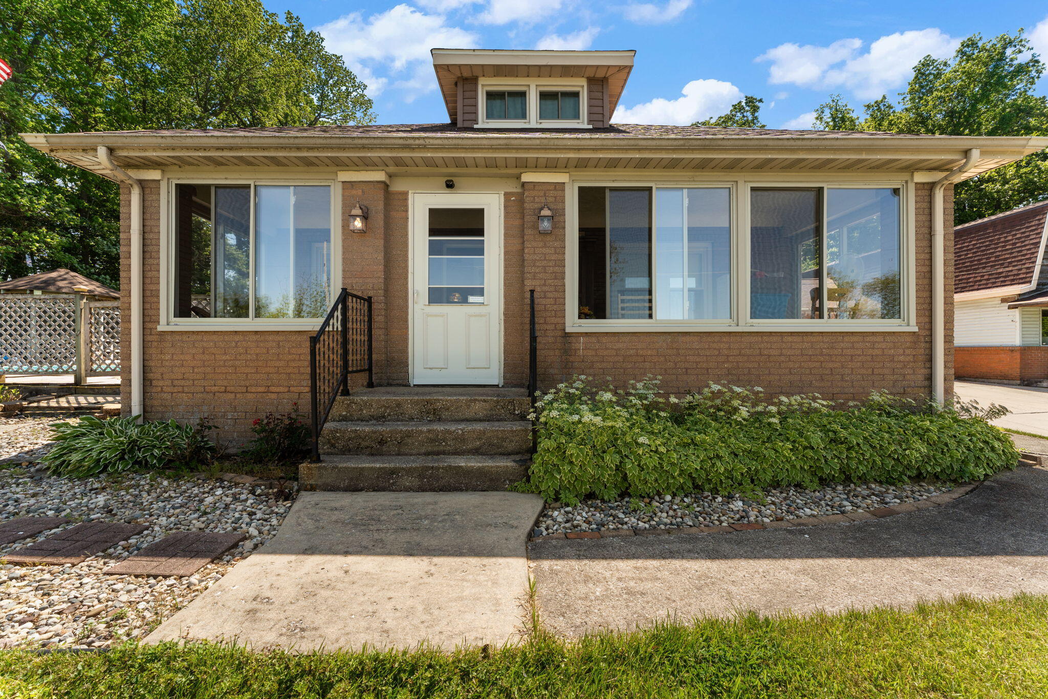 138 McClung Road La Porte, IN 46350 - Photo 2 of 50 a front view of a house with garden