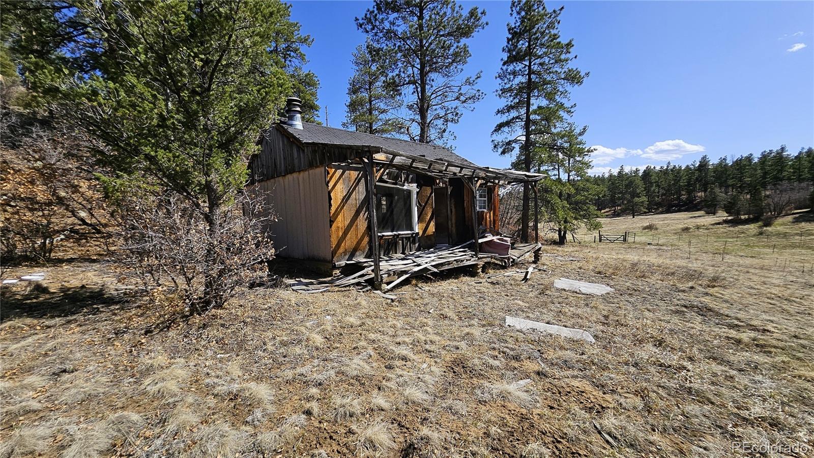 337 Rancho La Weston, CO 81091 - Photo 14 of 19 a view of a wooden house with a yard