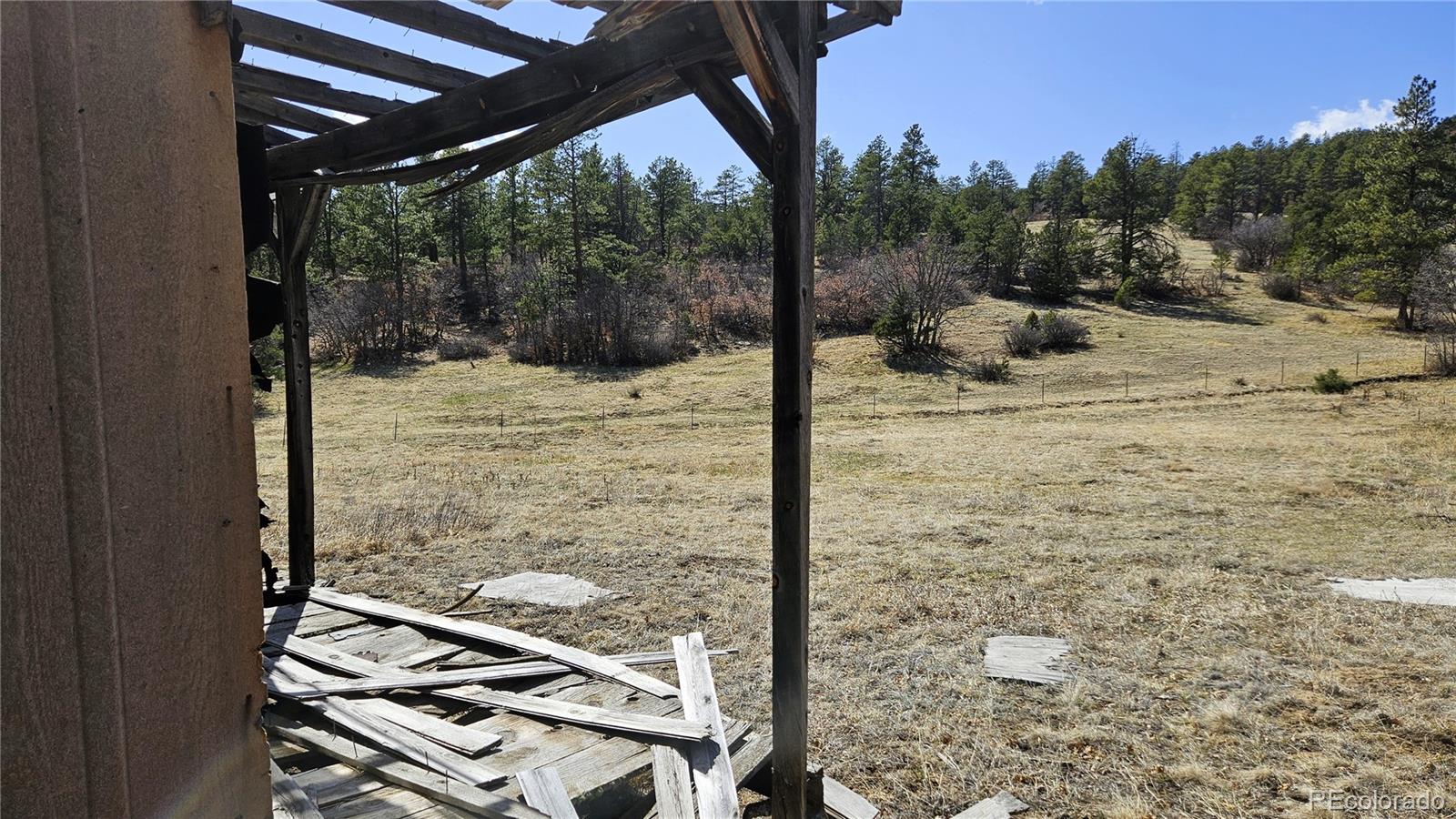 337 Rancho La Weston, CO 81091 - Photo 16 of 19 a view of a balcony with a floor to ceiling window and wooden fence