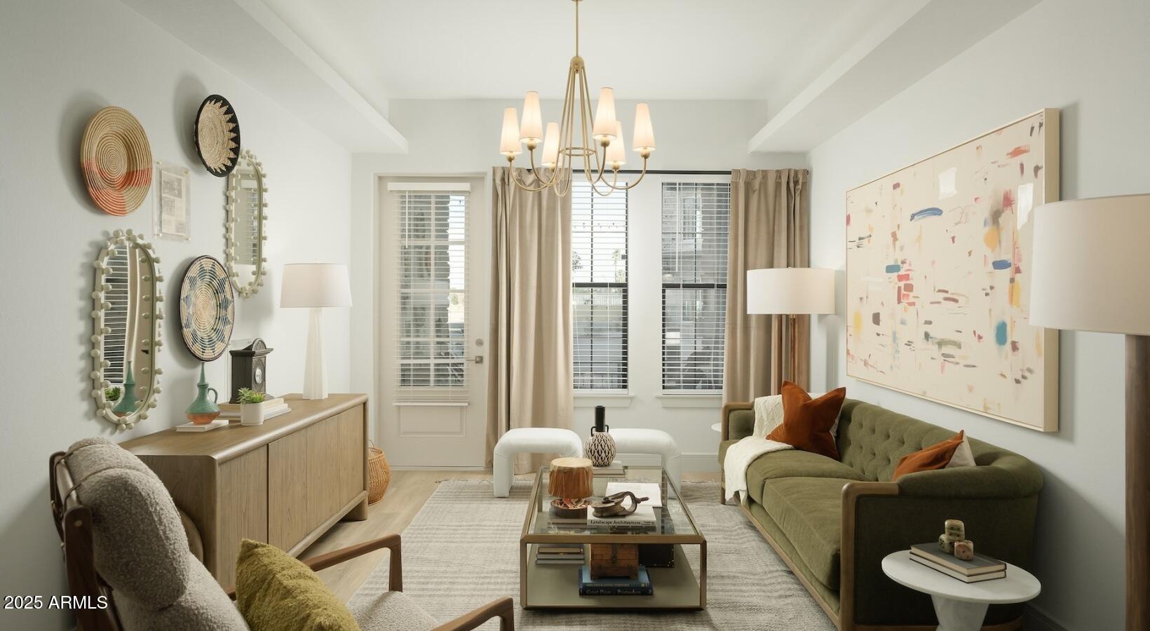 98 South River Drive, Unit B3 Tempe, AZ 85288 - Photo 3 of 20 a living room with furniture a chandelier and a large window