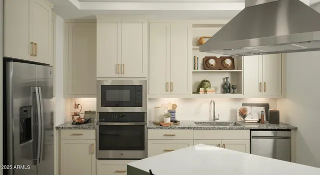 a kitchen with a refrigerator and a stove