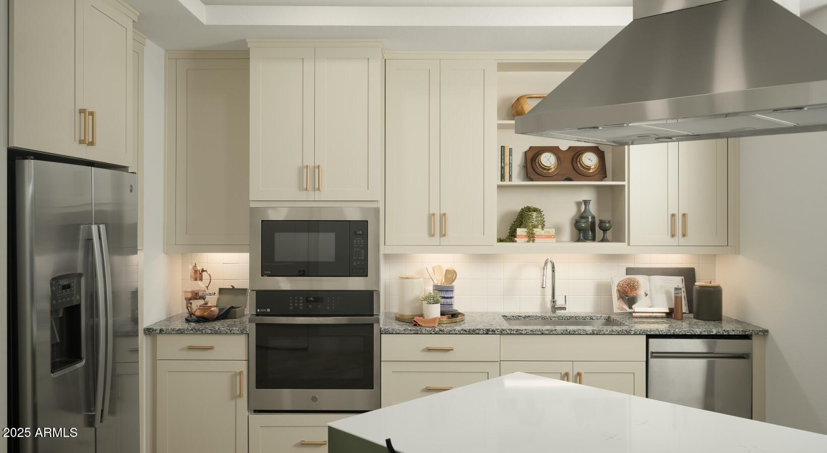 98 South River Drive, Unit B3 Tempe, AZ 85288 - Photo 5 of 20 a kitchen with a refrigerator and a stove