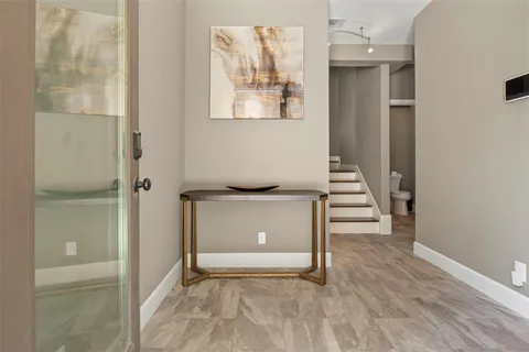 a view of an entryway with wooden floor