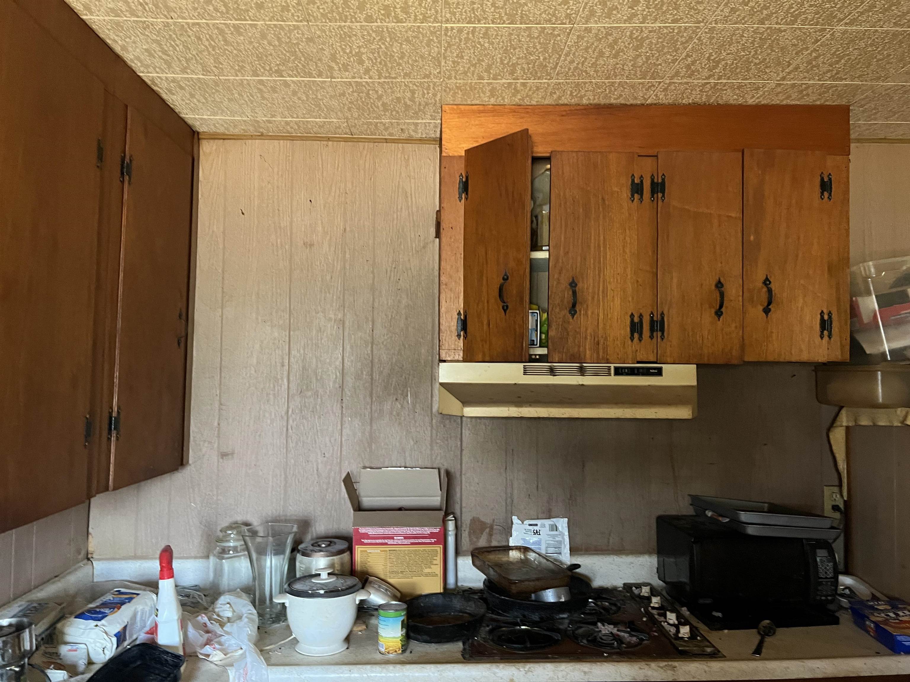 1034 Ranch Road 2545 Kingsland, TX 78639 - Photo 22 of 30 a kitchen with a sink and a stove next to a window